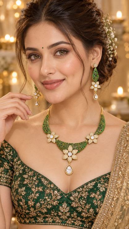 Model wearing the floral cubic zirconia Y-necklace and earring set in emerald green