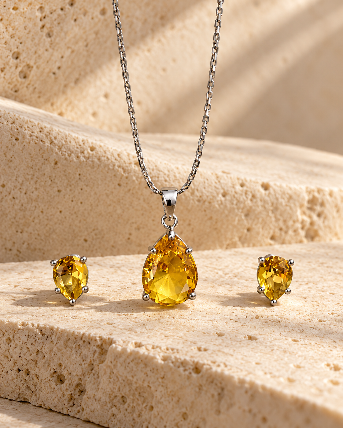 Pear Solitaire Chain Pendant and Stud Set in Yellow, Silver-tone setting, artistic stone display