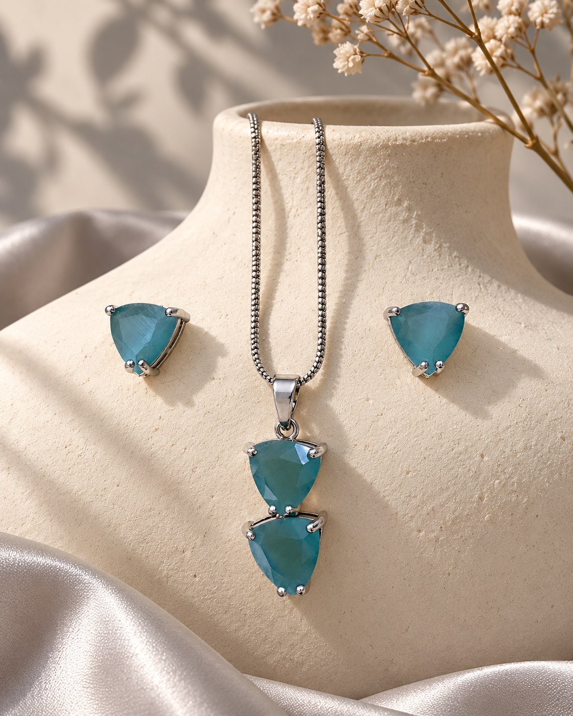 Twin Triangle Chain Pendant and Stud Set in Light Blue, Silver-tone setting, artistic jewellery display