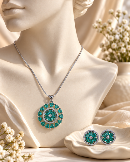 Round Sunburst Chain Pendant and Stud Set in Teal, Silver-tone setting, artistic jewellery display