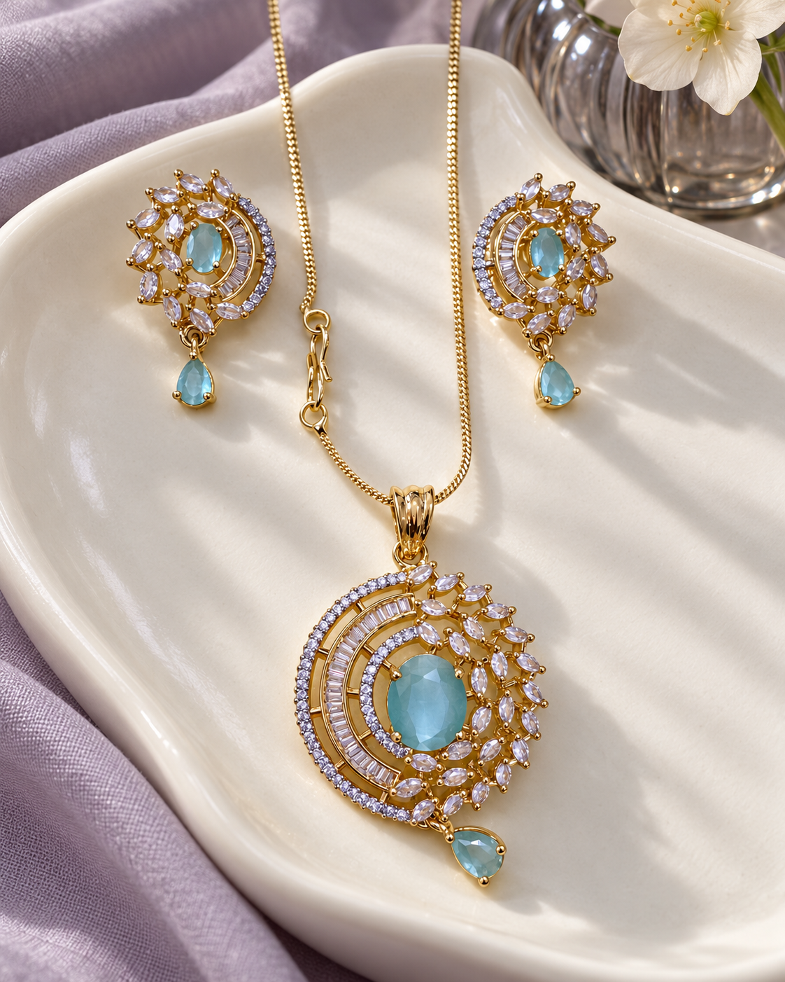 Celestial Halo Drop Chain Pendant and Earring Set in Light Blue, Gold-tone setting, artistic jewellery display