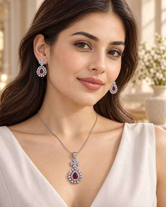 Model wearing floral bail pear halo chain pendant set in Red with Silver-tone finish