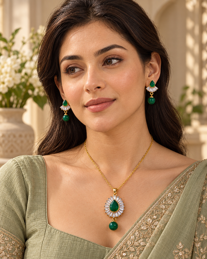 Model wearing green pear baguette chain pendant set in Green with Gold-tone finish